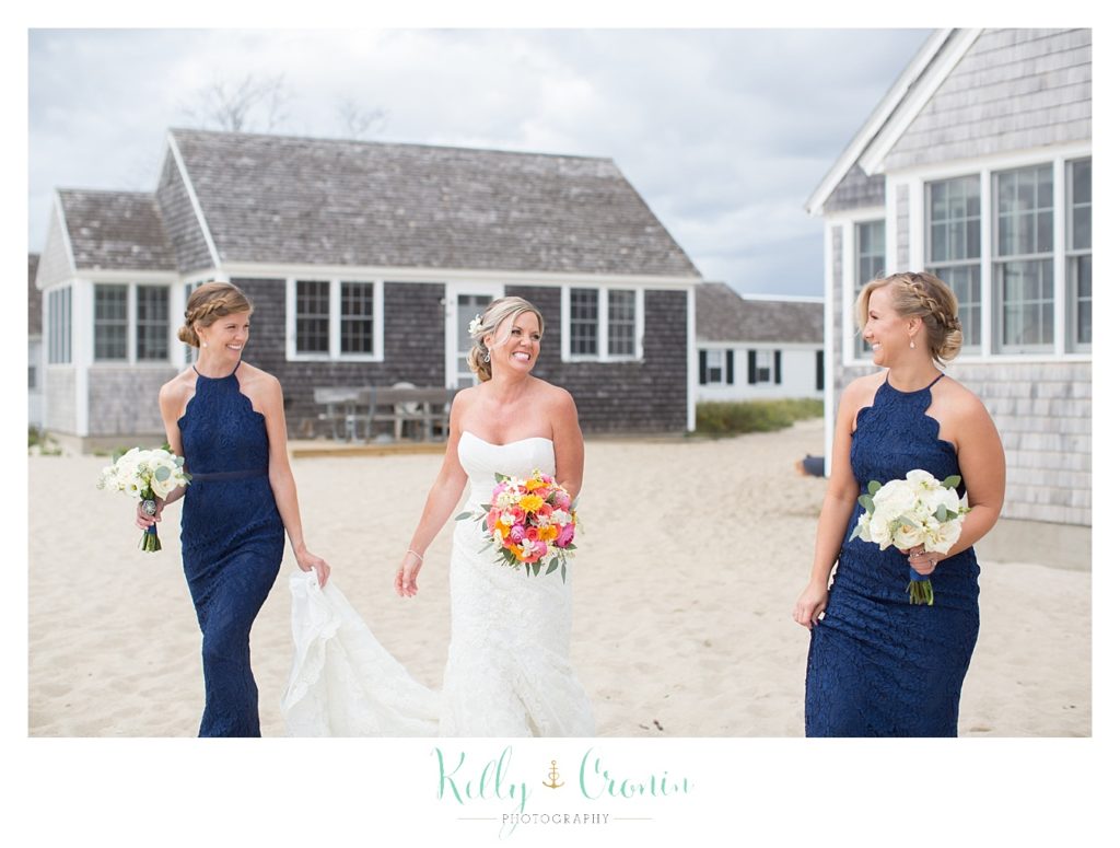 A bride walks with her friends | Kelly Cronin Photography | Cape Cod Wedding Photographer