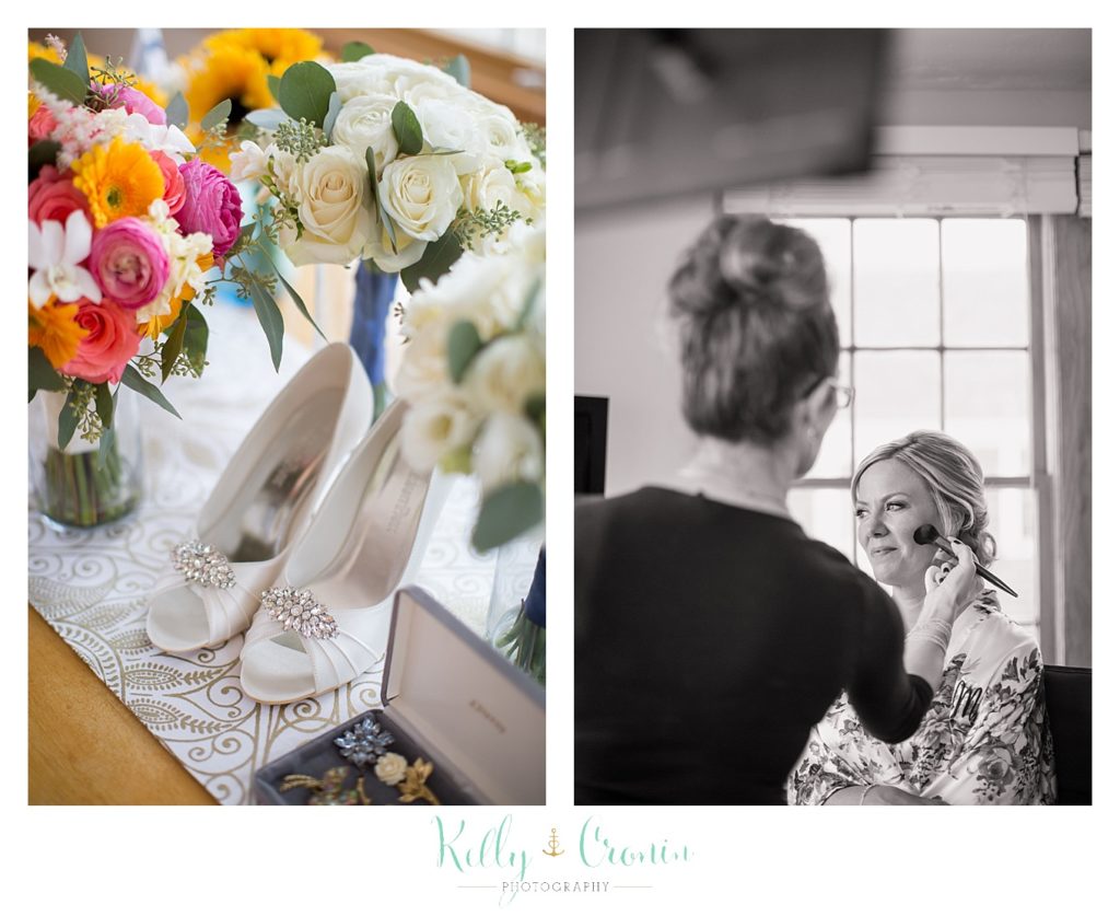 A woman puts make up on a bride | Kelly Cronin Photography | Cape Cod Wedding Photographer