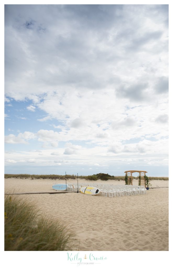 A wedding is set up on a beach | Kelly Cronin Photography | Cape Cod Wedding Photographer