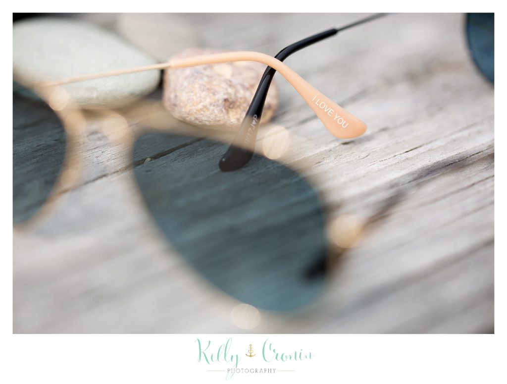 Sunglasses sit on a table | Kelly Cronin Photography | Cape Cod Wedding Photographer