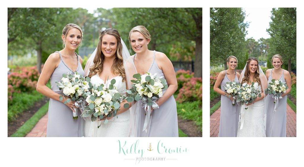 A bride poses with her bridesmaids | Kelly Cronin Photography | Cape Cod Wedding Photographer
