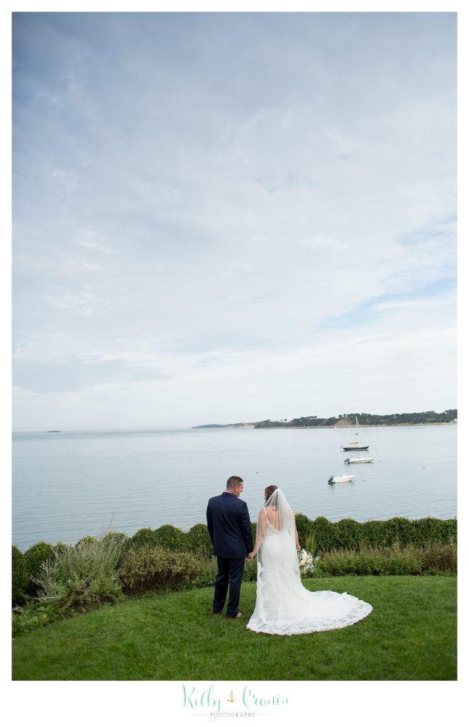 A groom holds his bride's hand | Kelly Cronin Photography | Cape Cod Wedding Photographer
