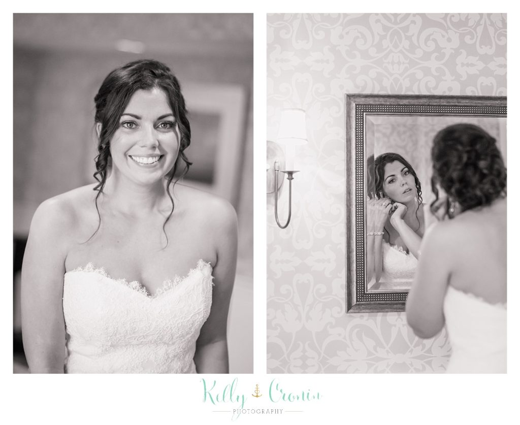 A bride puts her earrings into her ears | Kelly Cronin Photography | Cape Cod Wedding Photographer