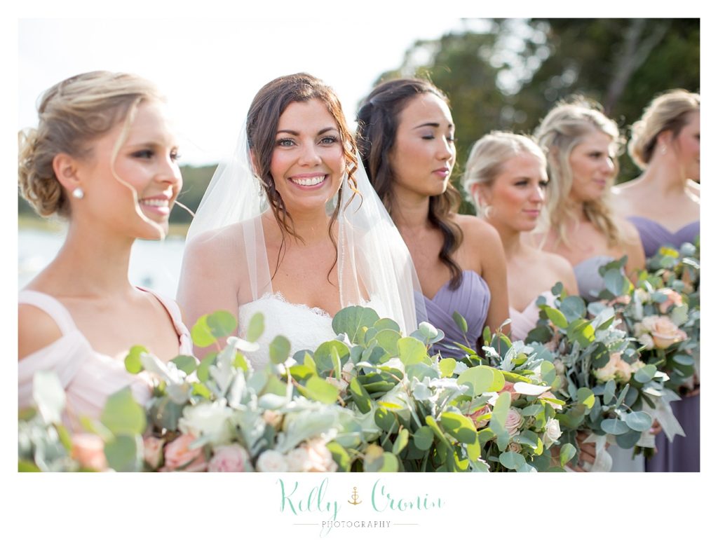 A bride stands with her bridal party | Kelly Cronin Photography | Cape Cod Wedding Photographer