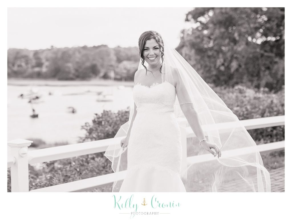 A bride's veil blows in the wind | Kelly Cronin Photography | Cape Cod Wedding Photographer