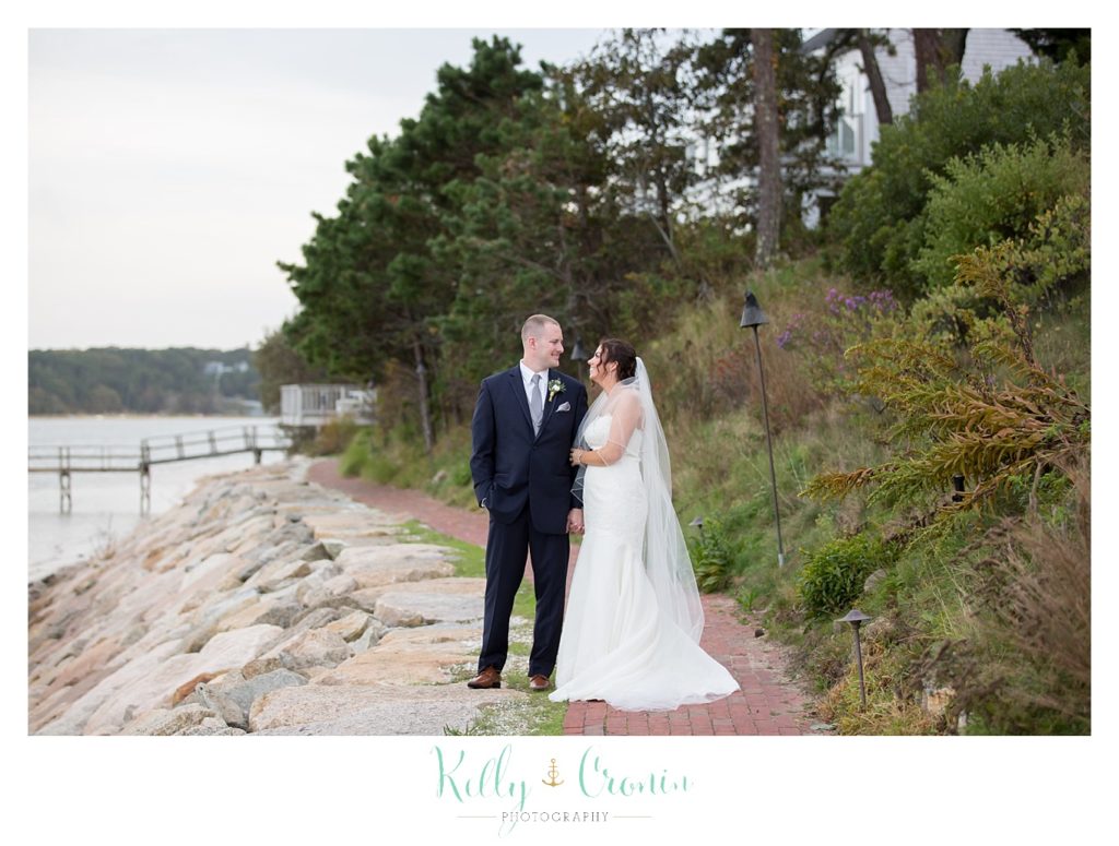 A man looks as his bride | Kelly Cronin Photography | Cape Cod Wedding Photographer