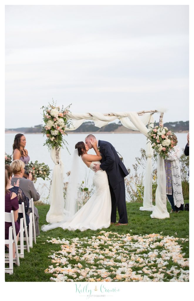 A couple shares their first married kiss | Kelly Cronin Photography | Cape Cod Wedding Photographer