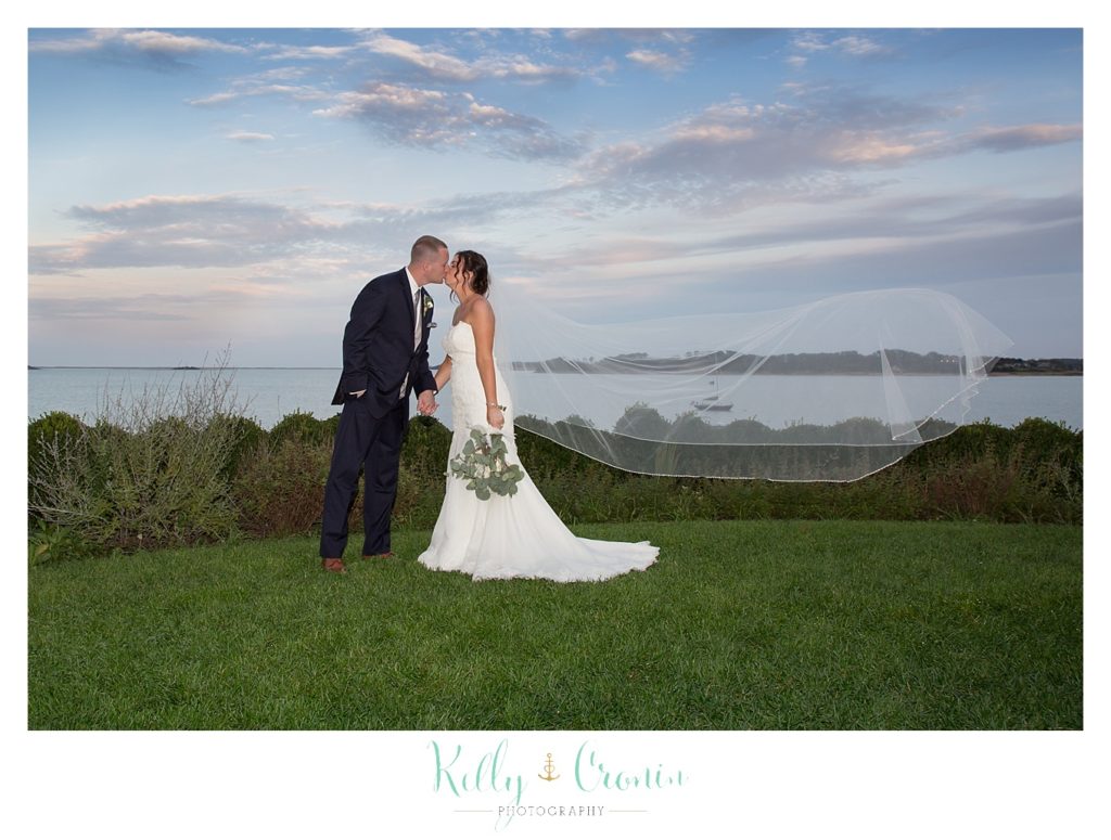 A bride kisses her new husband | Kelly Cronin Photography | Cape Cod Wedding Photographer