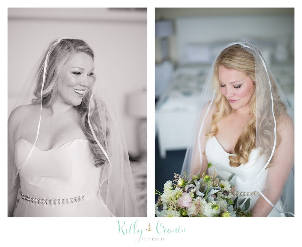 A bride looks at her flowers  | Kelly Cronin Photography | Cape Cod Wedding Photographer