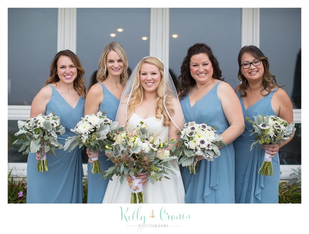 A bride smiles with her friends  | Kelly Cronin Photography | Cape Cod Wedding Photographer
