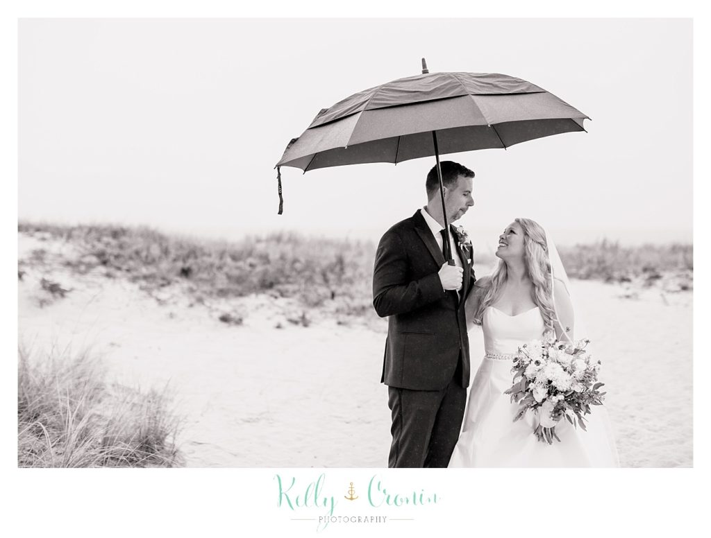 A wife looks up at her new husband  | Kelly Cronin Photography | Cape Cod Wedding Photographer