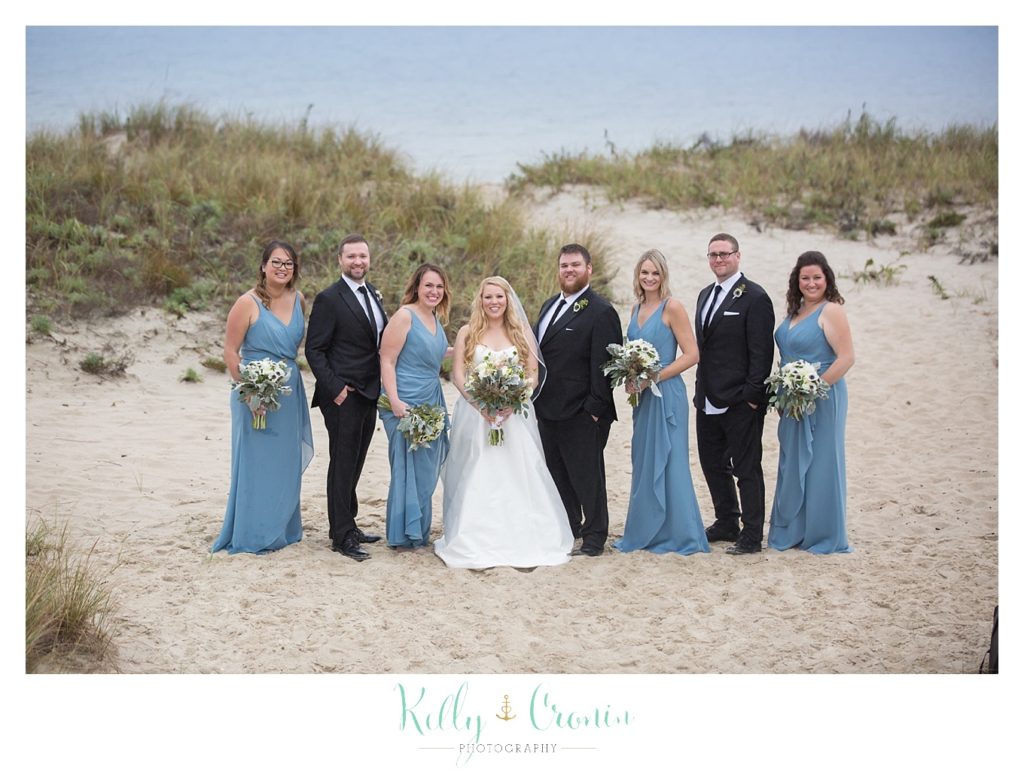A bride stands with her family  | Kelly Cronin Photography | Cape Cod Wedding Photographer
