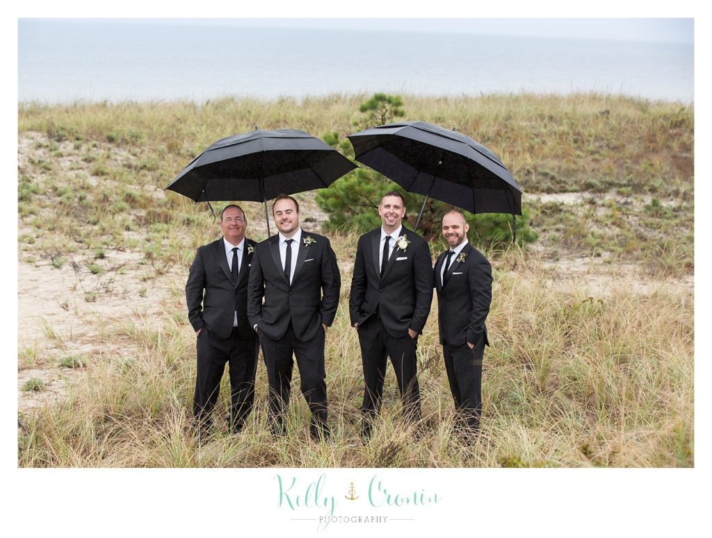 A groom stands with his friends  | Kelly Cronin Photography | Cape Cod Wedding Photographer