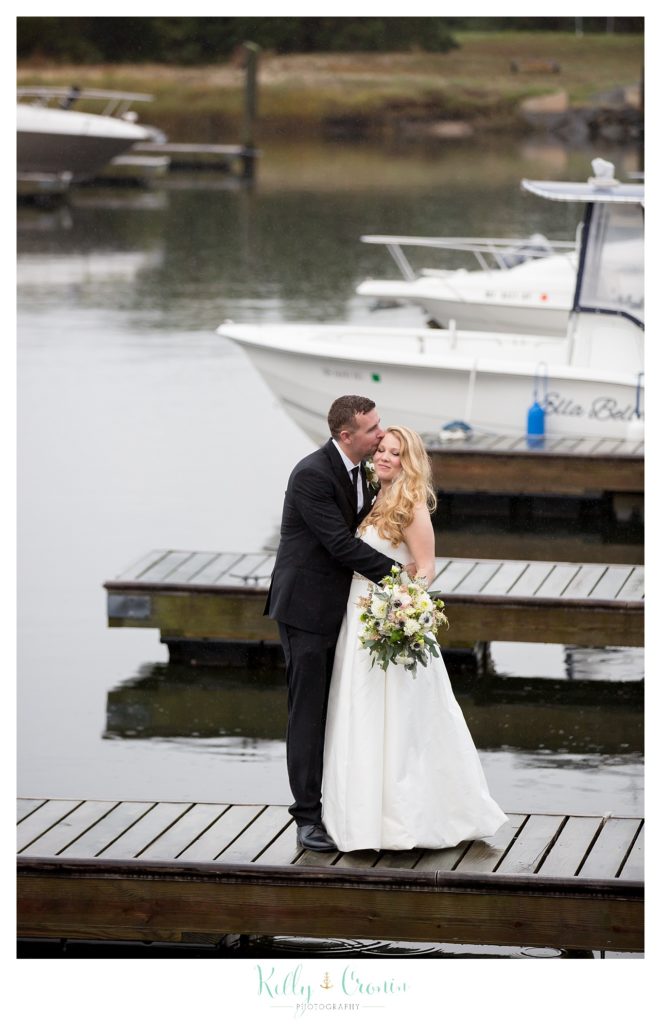 A man kisses his wife  | Kelly Cronin Photography | Cape Cod Wedding Photographer