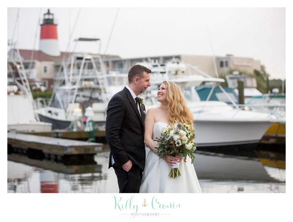 A wife looks at her groom  | Kelly Cronin Photography | Cape Cod Wedding Photographer