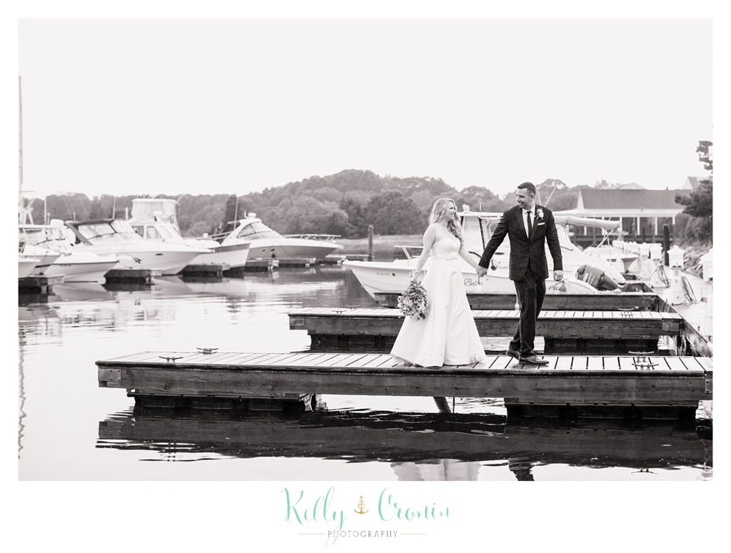 A man leads his wife  | Kelly Cronin Photography | Cape Cod Wedding Photographer