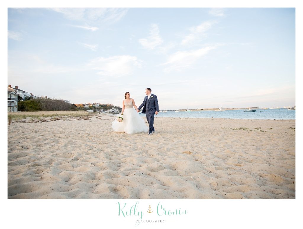 A couple walking | Kelly Cronin Photography | Cape Cod Wedding Photographer
