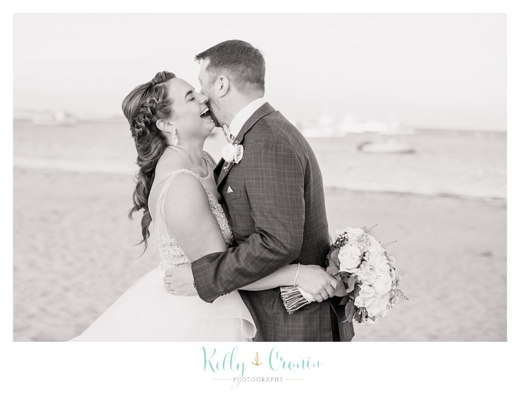 A man kisses his bride | Kelly Cronin Photography | Cape Cod Wedding Photographer