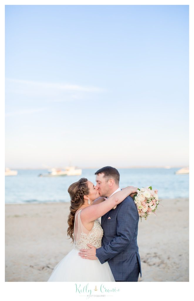 A bride kisses her groom | Kelly Cronin Photography | Cape Cod Wedding Photographer
