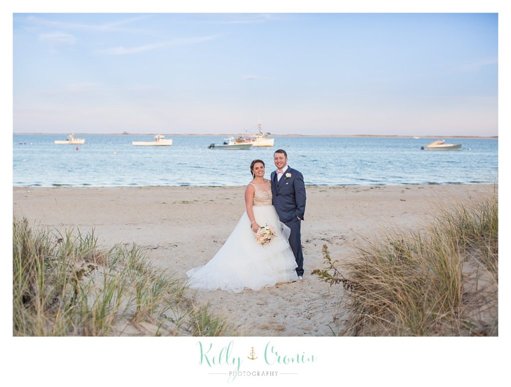 A newlywed couple stands together | Kelly Cronin Photography | Cape Cod Wedding Photographer