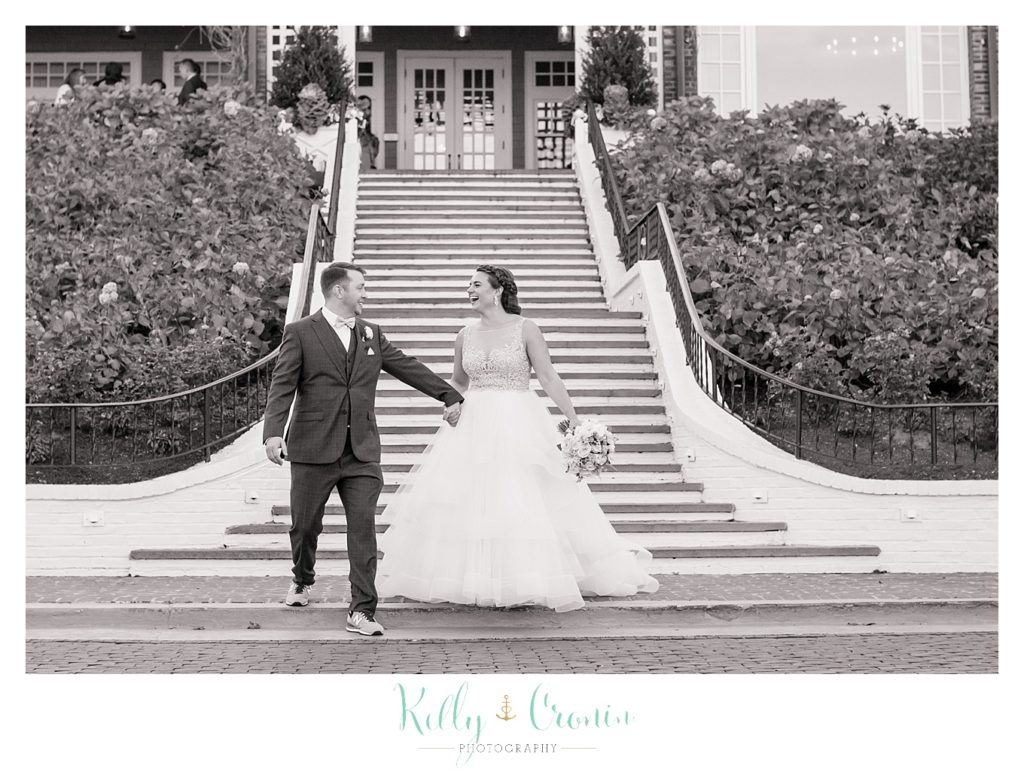 A couple walks down stairs | Kelly Cronin Photography | Cape Cod Wedding Photographer