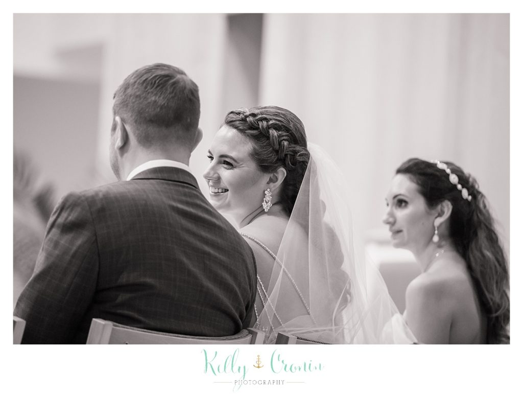 A bride looks at her husband to be | Kelly Cronin Photography | Cape Cod Wedding Photographer