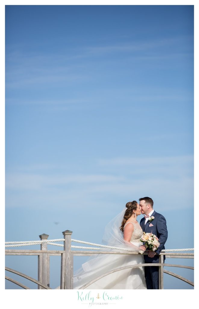 Kissing on a pier | Kelly Cronin Photography | Cape Cod Wedding Photographer