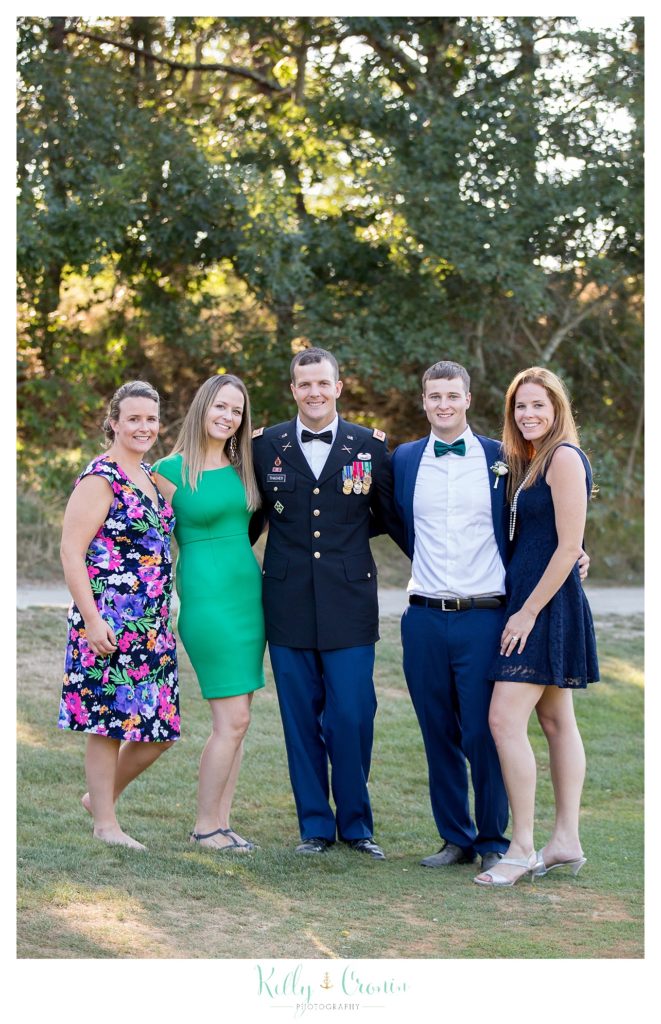 A groom stands with family | Wedding Photographer in Cape Cod | Kelly Cronin Photography