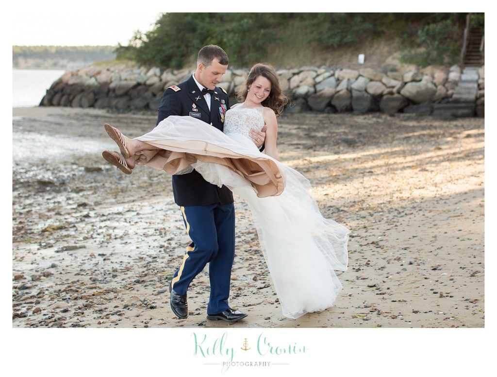 A man carries his bride | Wedding Photographer in Cape Cod | Kelly Cronin Photography
