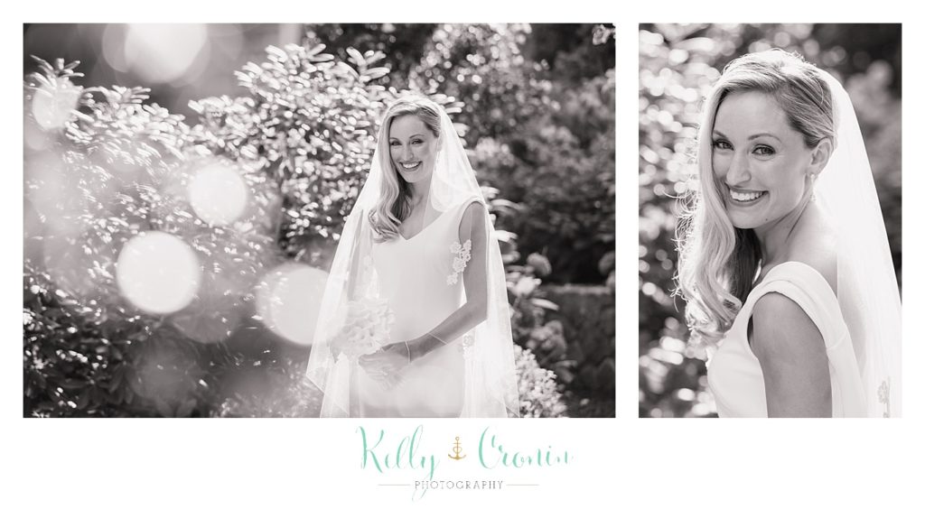 A bride poses for her bridal photos, getting ready for a Romance in Cape Cod. | Captured by Kelly Cronin Photography