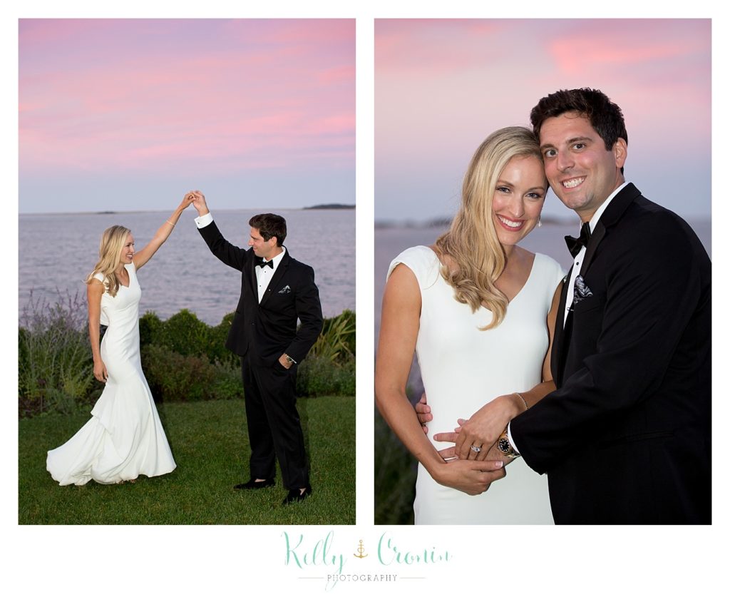 A man shows off his bride as he celebrates their Romance in Cape Cod. | Captured by Kelly Cronin Photography