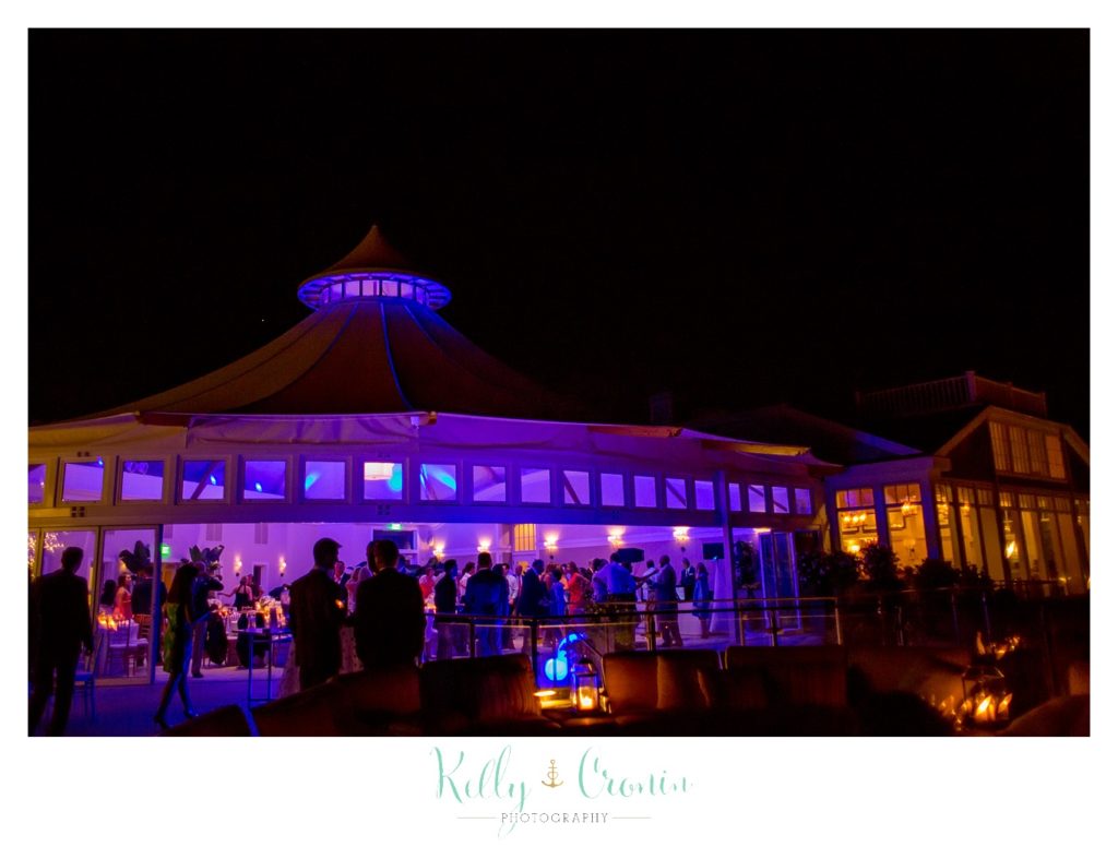 A venue uses romantic lighting to celebrate Romance in Cape Cod. | Captured by Kelly Cronin Photography