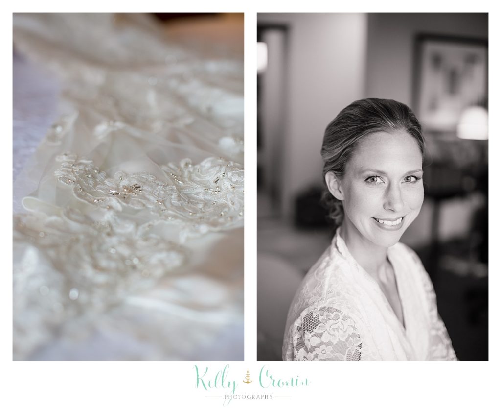 A bride smiles in her robe wedding held at the White Cliffs Country club and captured by Kelly Cronin Photography