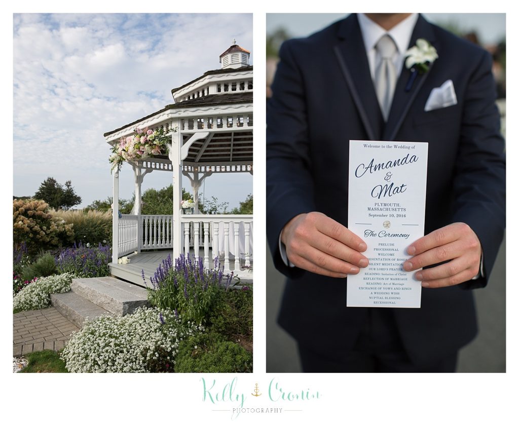 A groom holds his wedding invitation, wedding held at the White Cliffs Country club and captured by Kelly Cronin Photography