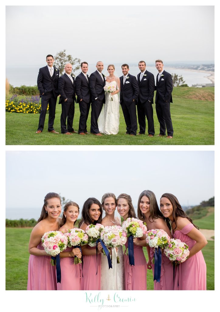 A wedding party pose for photos, wedding held at the White Cliffs Country club and captured by Kelly Cronin Photography