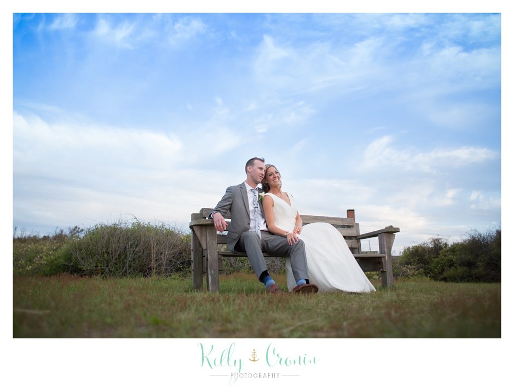 A couple take a moment to relax before returning to their wedding at The Dennis Inn, captured by Kelly Cronin Photography