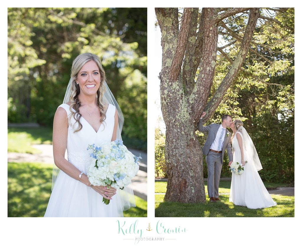 A bride smiles for wedding photos outside of The Dennis Inn, captured by Kelly Cronin Photography
