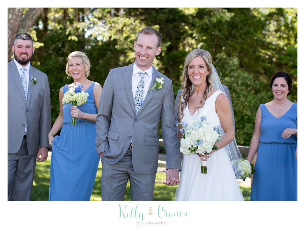 A couple get ready for photos after their wedding at The Dennis Inn, captured by Kelly Cronin Photography