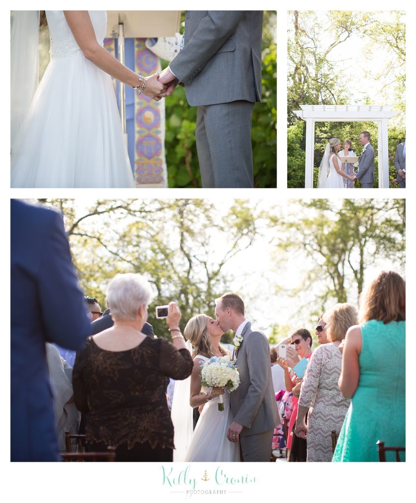 A couple kiss at their reception held at The Dennis Inn, captured by Kelly Cronin Photography