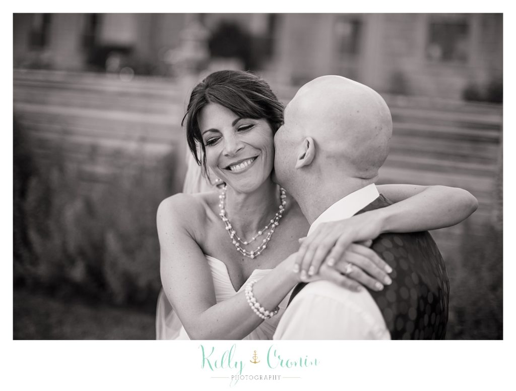 A groom kisses his bride | Kelly Cronin Photography | Chatham Wedding Photographer