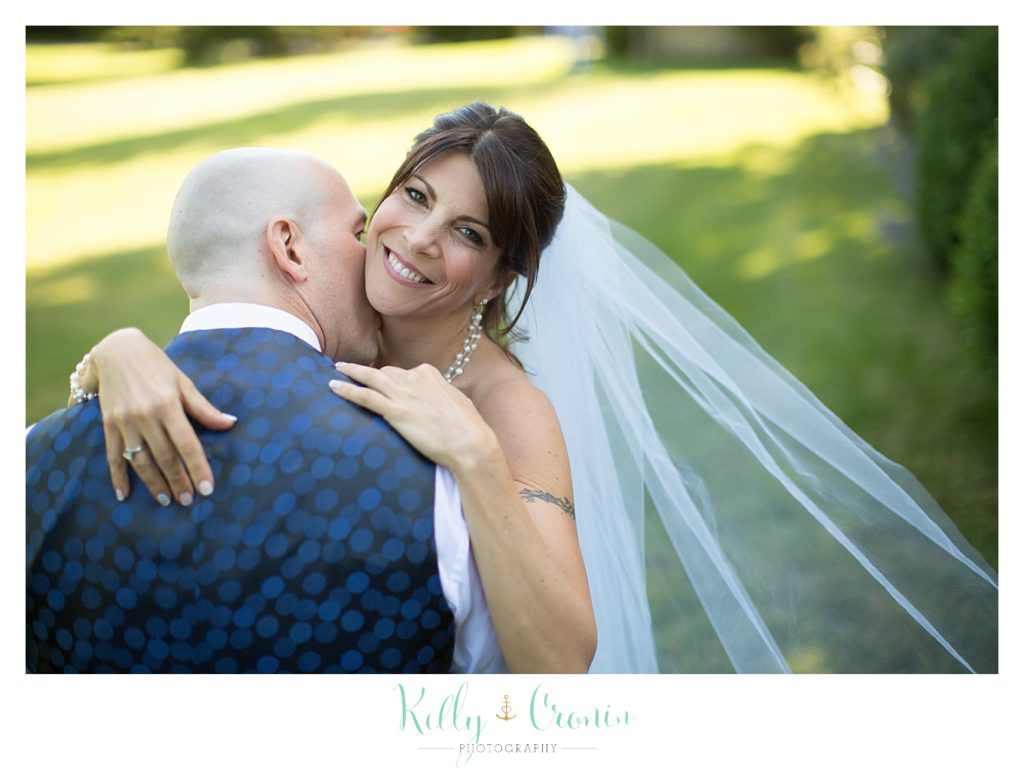 A man kisses his wife | Kelly Cronin Photography | Chatham Wedding Photographer