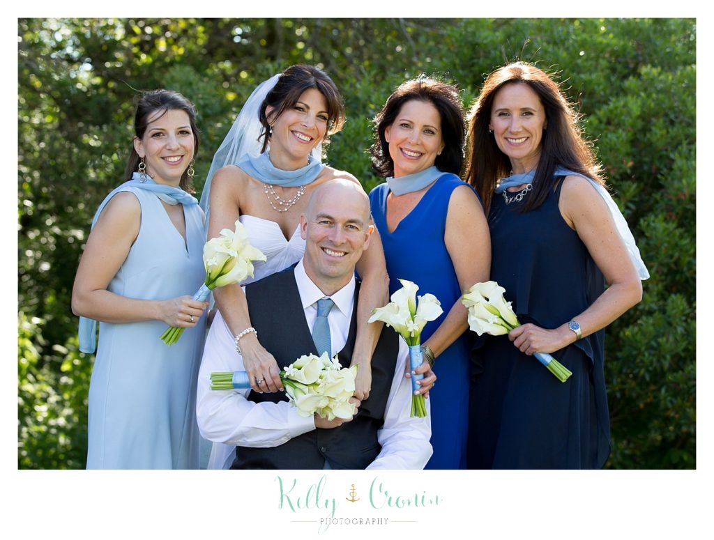 A bridal party surrounds the groom | Kelly Cronin Photography | Chatham Wedding Photographer