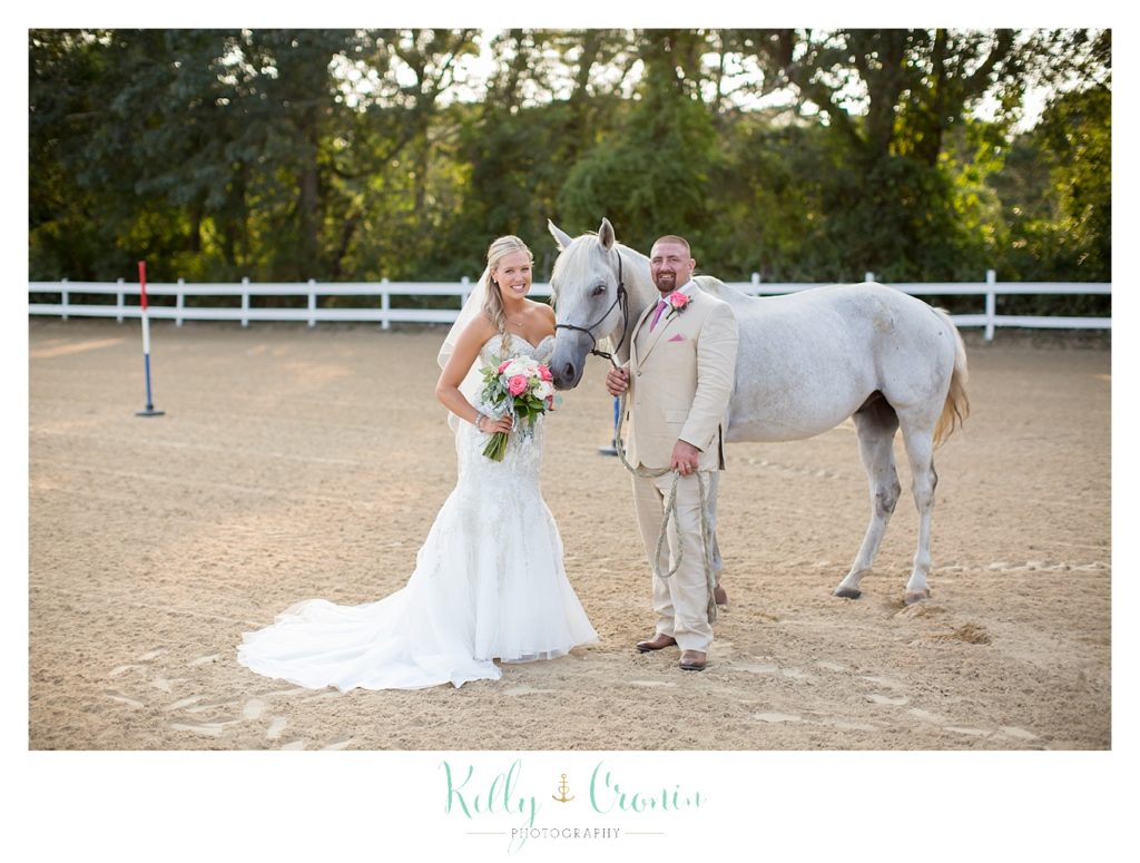 A bride leads a horse | Kelly Cronin Photography | CJ's Ranch
