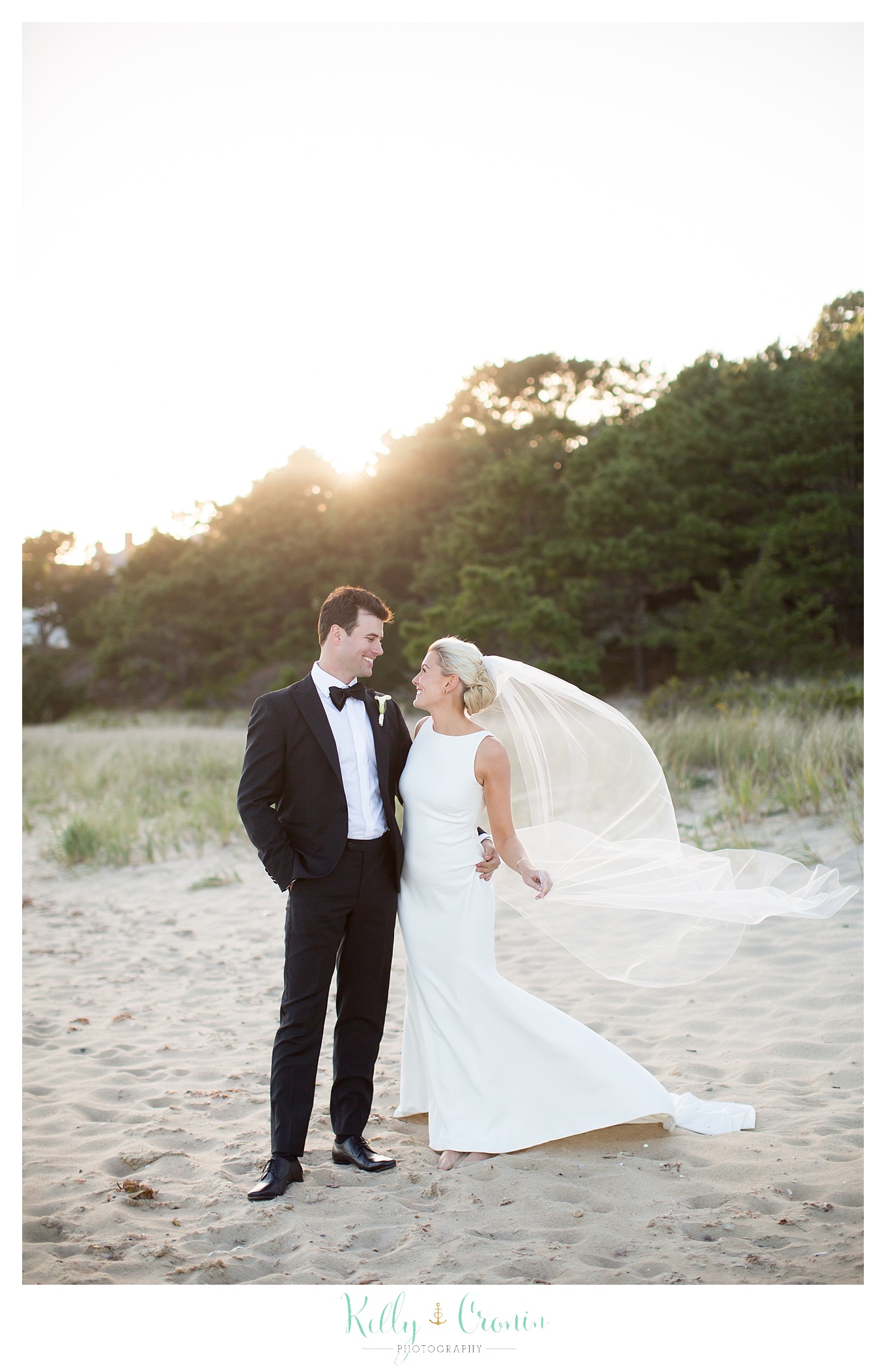 A bride looks into her groom's eyes | Kelly Cronin Photography | Popponesset Inn