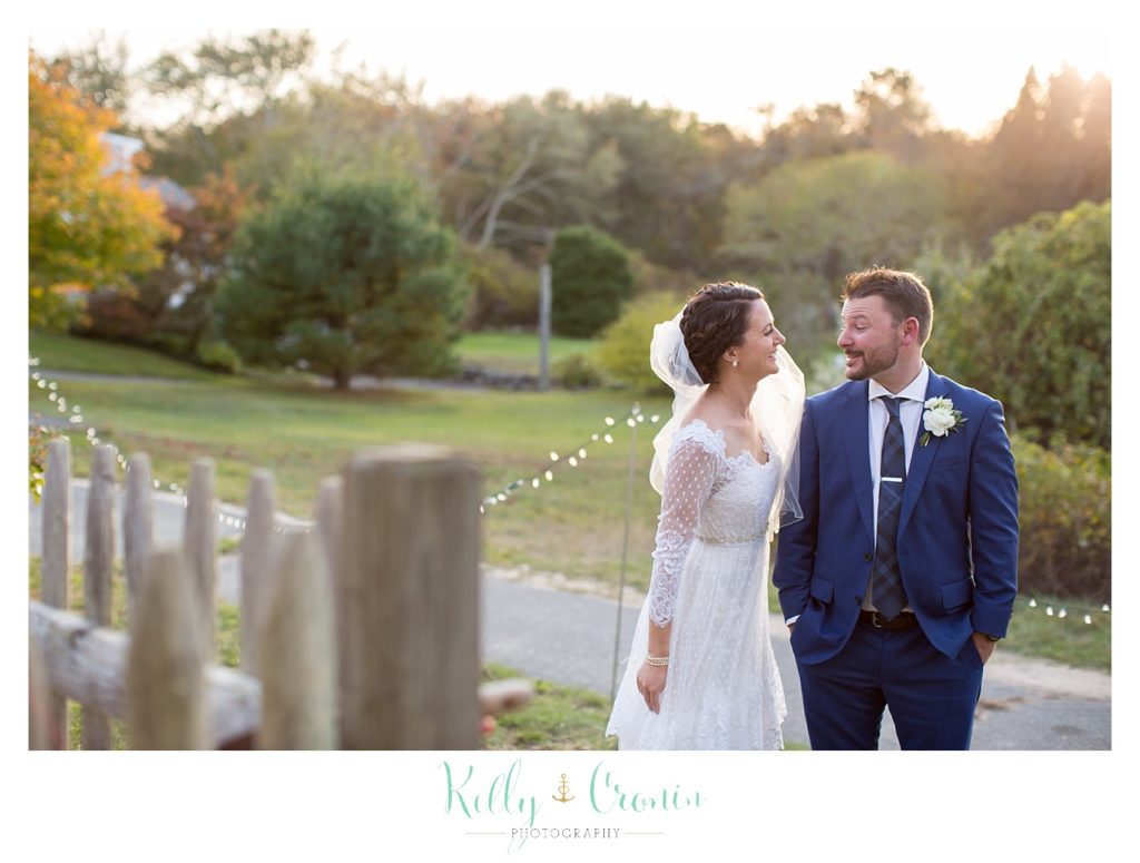 A newly married couple enjoy some quiet time together, this was a Mooncussers Tavern Reception, captured by Kelly Cronin Photography