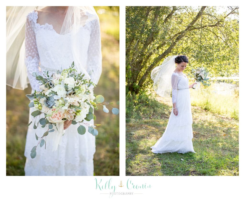 A bride holds her flowers, this was a Mooncussers Tavern Reception, captured by Kelly Cronin Photography