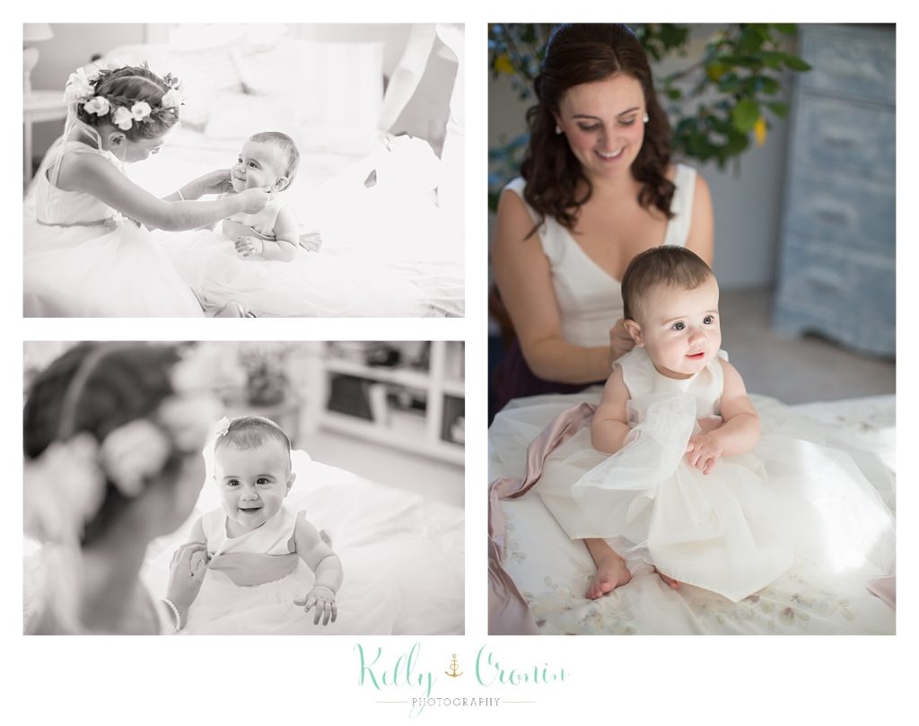 A baby is dressed for a wedding, this was a Mooncussers Tavern Reception, captured by Kelly Cronin Photography