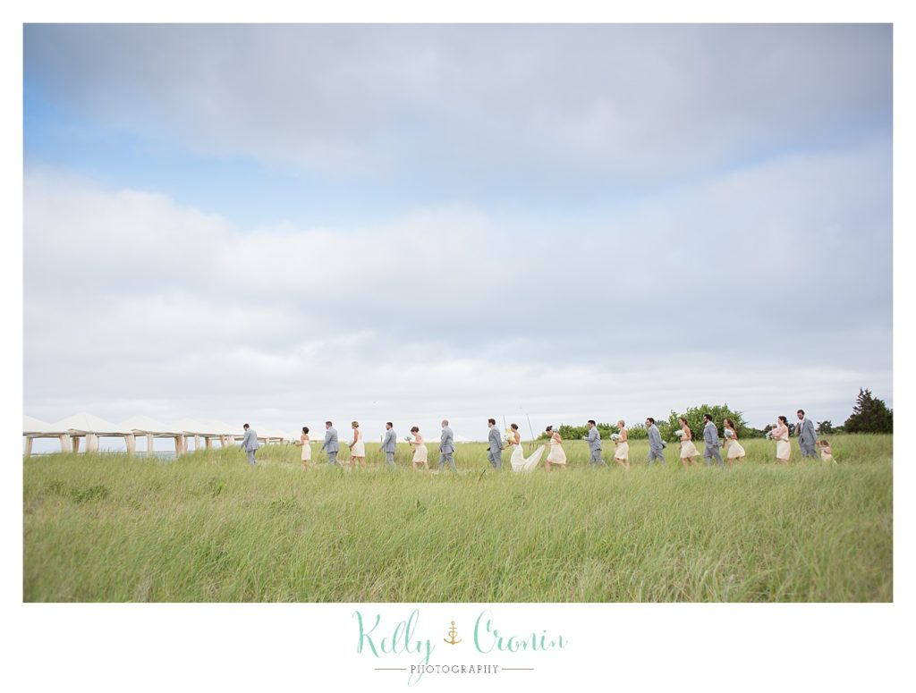 A wedding party stands together | Kelly Cronin Photography | Lighthouse Beach