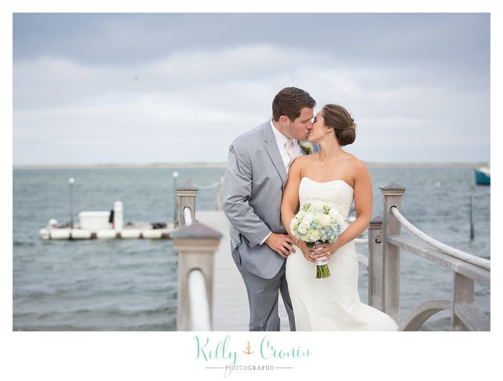 A bride and groom share an intimate moment | Kelly Cronin Photography | Lighthouse Beach