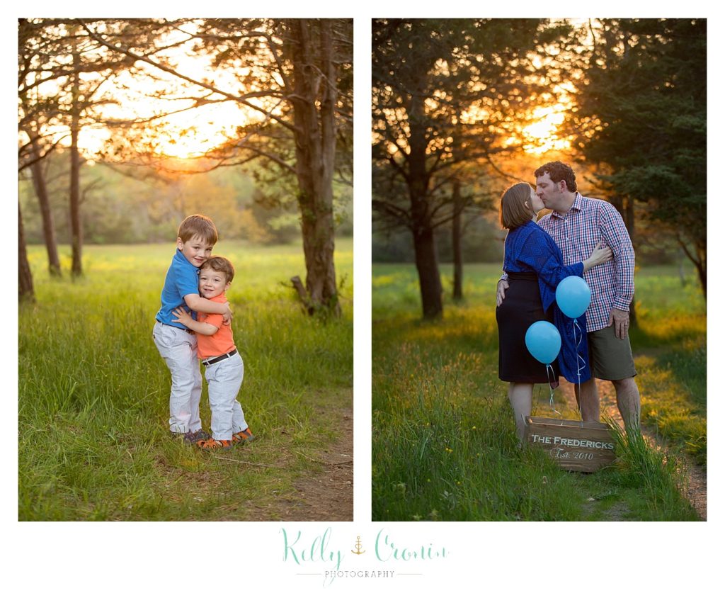 Parents kiss in excitement over the news of another son | Kelly Cronin Photography | Cape Cod Family Photographer 